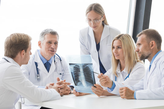 Team of expert doctors with x-ray