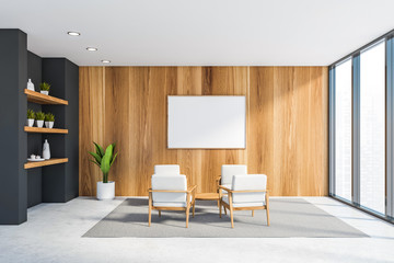 Wooden office lounge with armchairs and poster
