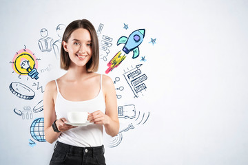 Smiling woman with coffee and her startup project