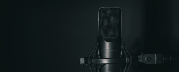 studio black microphone in the dark room