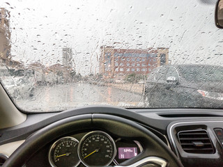 rain on car windshield in rainy season