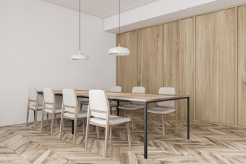 Long table in white and wooden cafe corner