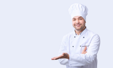 Chef Gesturing With Hand Pointing At Free Space, White Background