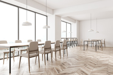 Panoramic white restaurant corner with tables