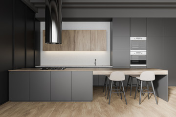 Gray and wooden kitchen interior with bar