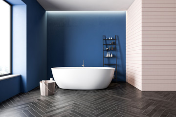 Blue and beige bathroom interior with tub