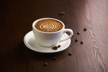 Cup of latte or Cappuccino on table in cafe.