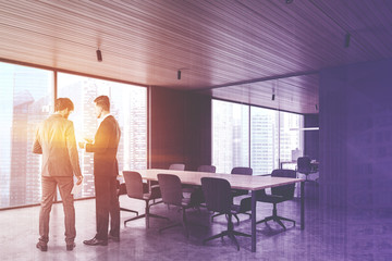 Business people in gray conference room