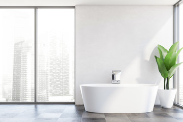 Panoramic white bathroom interior with tub