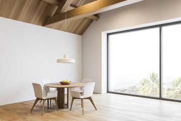 White dining room in spacious mansion