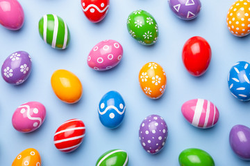 Flat lay composition made with Easter eggs on color background. Top view 