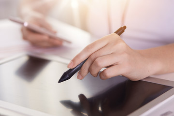 Close up faceless portrait of woman working with stylus on digital tablet pc, female holding smart...