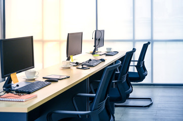 View of interior at office work place with computer.