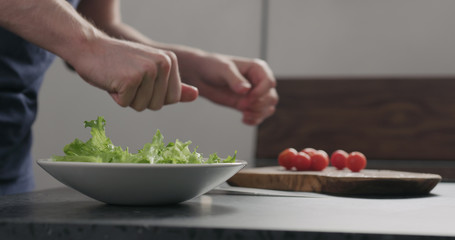 add frisee salad leaves into white bowl