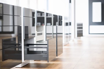 Opened kitchen drawer with cutlery tray. Two drawers are hide behind the high front. Smart storage...
