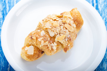 Fresh croissant on a plate.