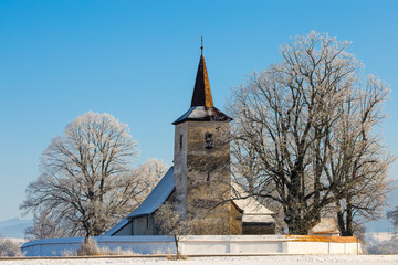 Fototapeta na wymiar Gothic church in Ludrova in winter