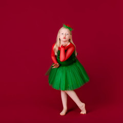 Kid dancer satisfied with concert outfit. Kids fashion. Kid fashionable green dress looks adorable. Clothes for ballroom dance. Ballroom dancewear fashion concept.