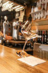 a glass of red wine at the bar