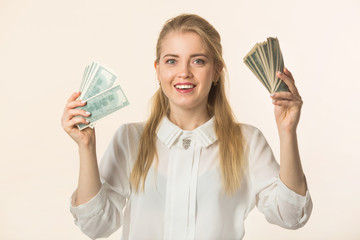 beautiful young woman with dollars in hands