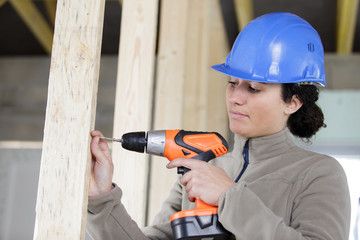 young woman with a drill