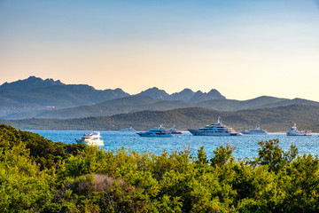 Capriccioli, Sardinia, Italy - Panoramic view of the Costa Smeralda - Emerald Cost - seaside with luxury yachts near Capriccioli beach at the Tyrrhenian Sea coast