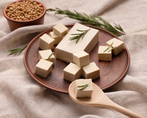 Healthy lifestyle concept. Tofu and sprig of rosemary