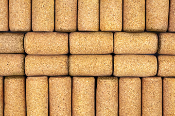Background from textured wine corks, top view. place for text