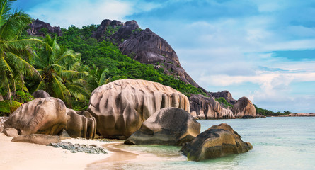 Famed for being one of the most photographed beaches on the planet Anse Source d'Argent at sunny summer day - beautiful and tropical coast in Indian ocean, Seychelles island