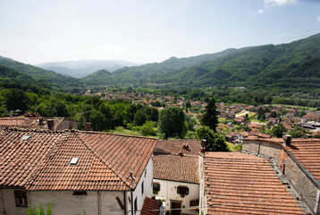 Fototapeta na wymiar Terracotta tiled rooftops in the village of Ghivizzano