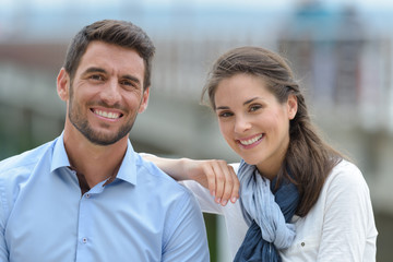 a happy couple is outdoors