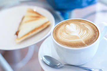hot latte coffee drink and sandwich put on table breakfast in the morning day