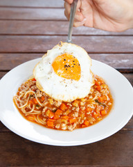 Italian spaghetti bolognese with tomato sauce and fried egg