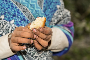 abandoned orphan  boy very hungry in camp and his eyes are full of pain