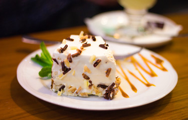 a plate with tasty big white cake