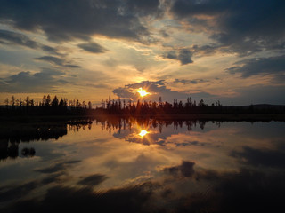 Fototapeta premium sunset in clouds above the surface of the lake
