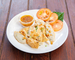 Sliced Chinese fish sausage with Thai spicy sauce
