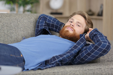 man on the sofa relaxing in his living room