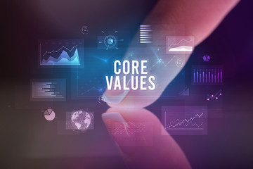 Finger touching tablet with charts and CORE VALUES inscription, business concept
