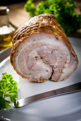 Baked rolled bacon with spices.