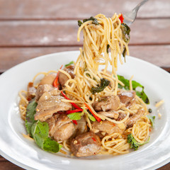 Spaghetti stir fried spicy thai pad ki mao chicken