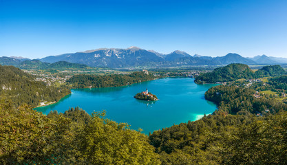 Naklejka na ściany i meble Aerial panoramic view on the Pilgrimage Church of the Assumption of Maria on the Lake Bled