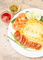 Rice topped with omelet and Chinese sausage