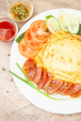 Rice topped with omelet and Chinese sausage