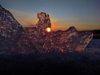 Beautiful winter sunset through the ice