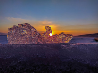 Beautiful winter sunset through the ice