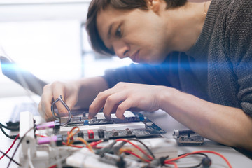 student making measurement and costruct the circuit board with engineer equipment, studying process
