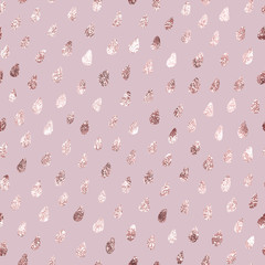 Gold rain. Beautiful delicate backdrop. Golden glitter marble imitation rose gold. Elegant drops seamless pattern. Stylish prints. Repeating background for design wallpaper, wrapping paper, gift wrapp