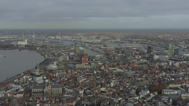 Antwerp Belgium Aerial v5 Flying backwards over downtown with views of industrial area, Eilandje and surrounding districts - November 2019