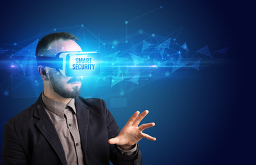 Businessman looking through Virtual Reality glasses with SMART SECURITY inscription, cyber security concept